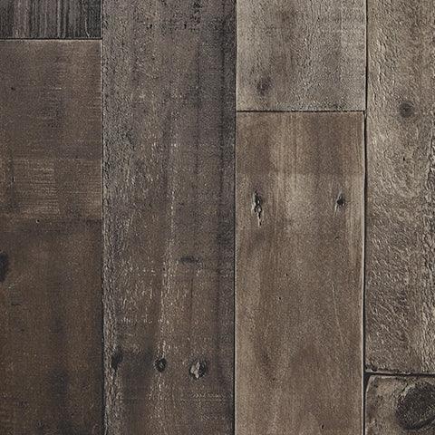Close-up of Derekson entertainment center's rustic multi gray finish and fireplace detail