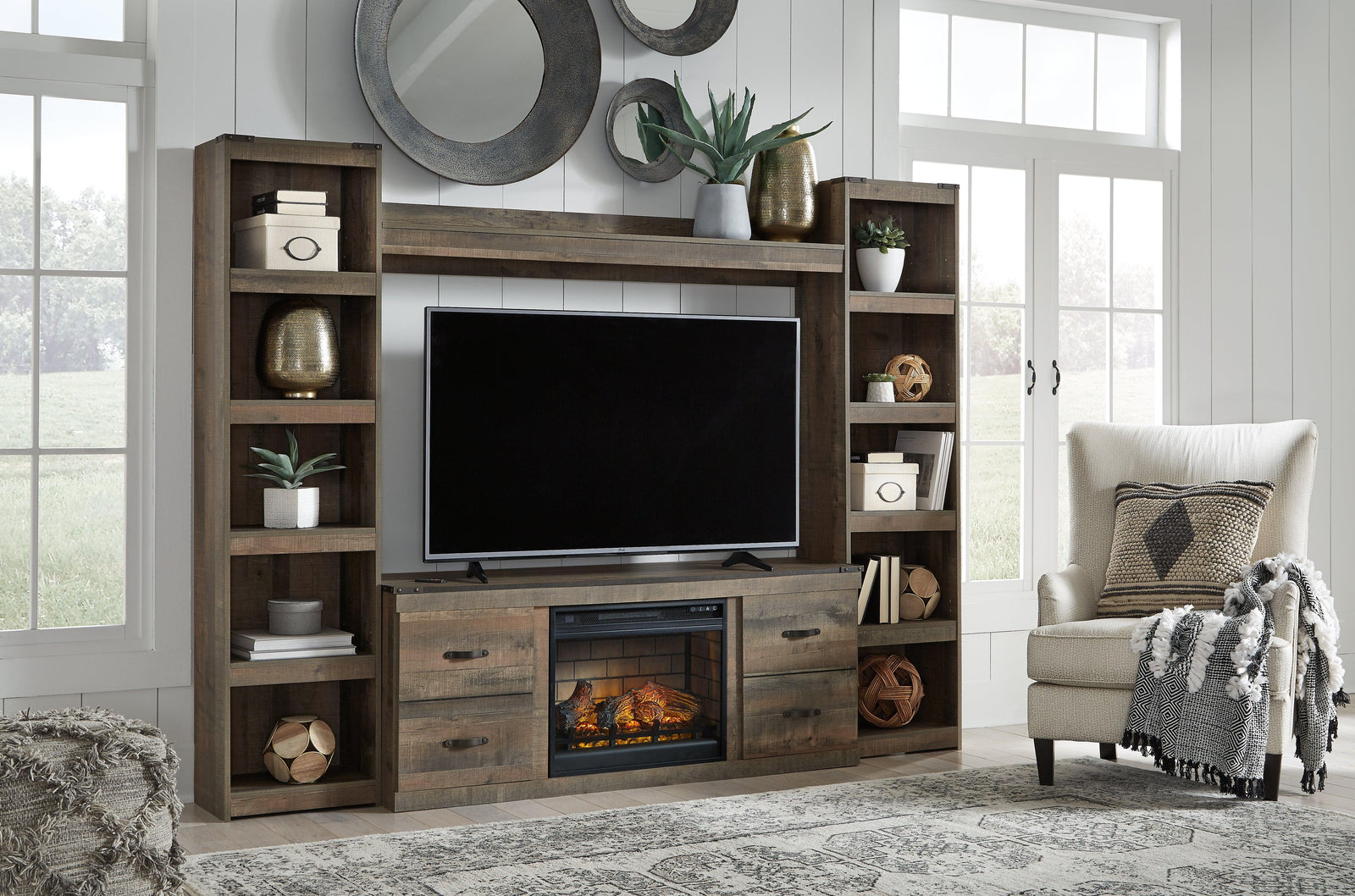 Trinell Brown 4-Piece Entertainment Center With Electric Fireplace EW0446W9 - Ella Furniture