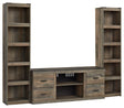 Trinell Brown 3-Piece Entertainment Center showing front view with TV stand and piers