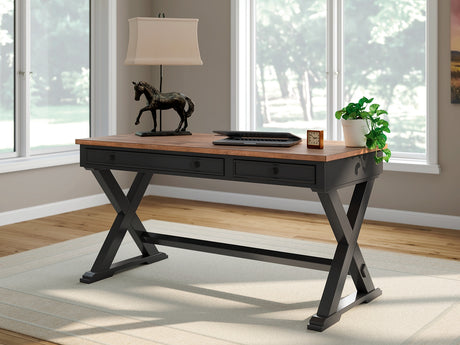 Wildenauer 60" home office desk front angle showing butcher block top and black base