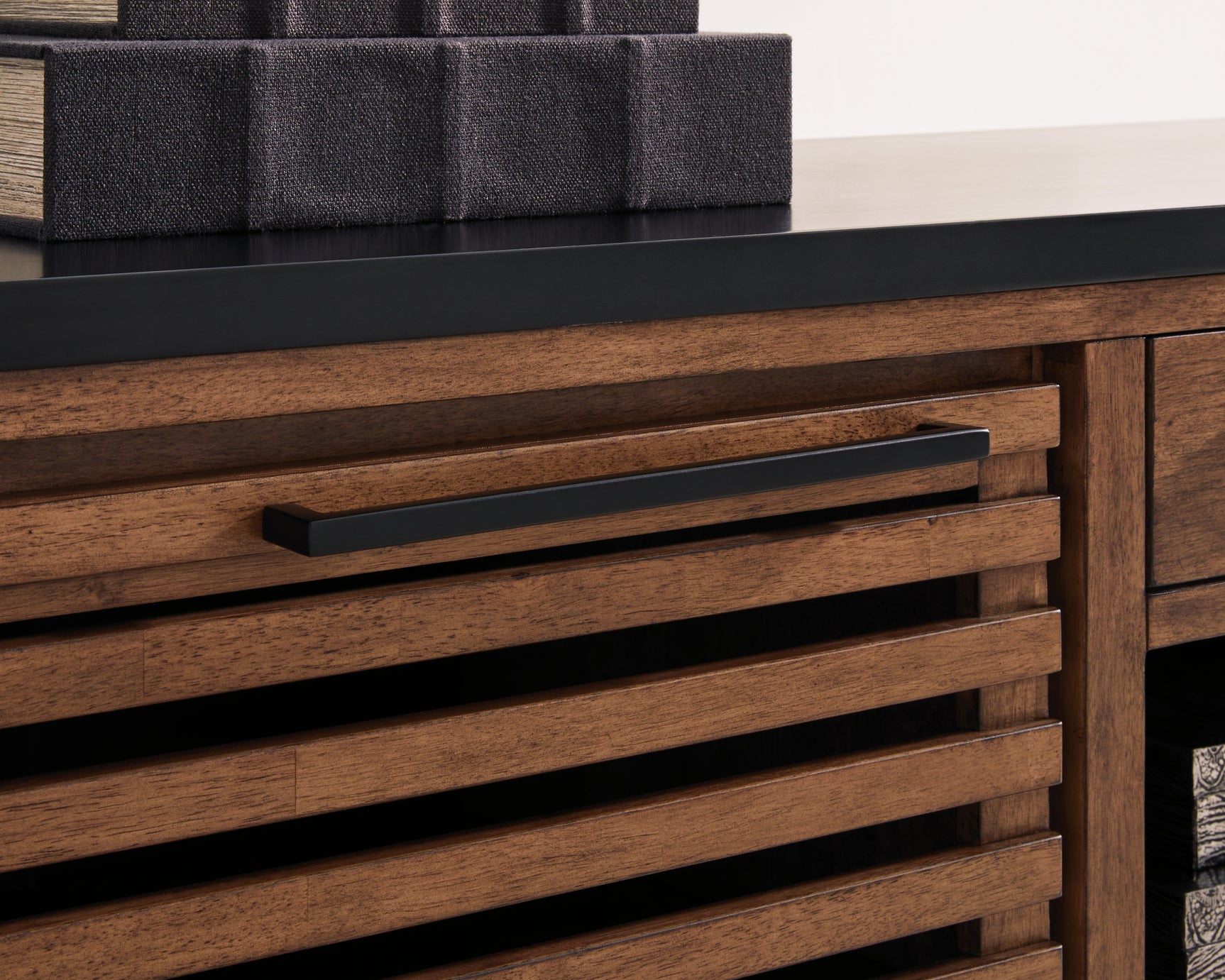 Kallari Credenza close-up of blackened steel bar pull handle