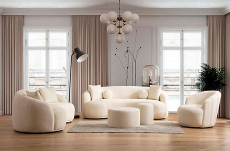 Ivory boucle round ottoman in living room setting
