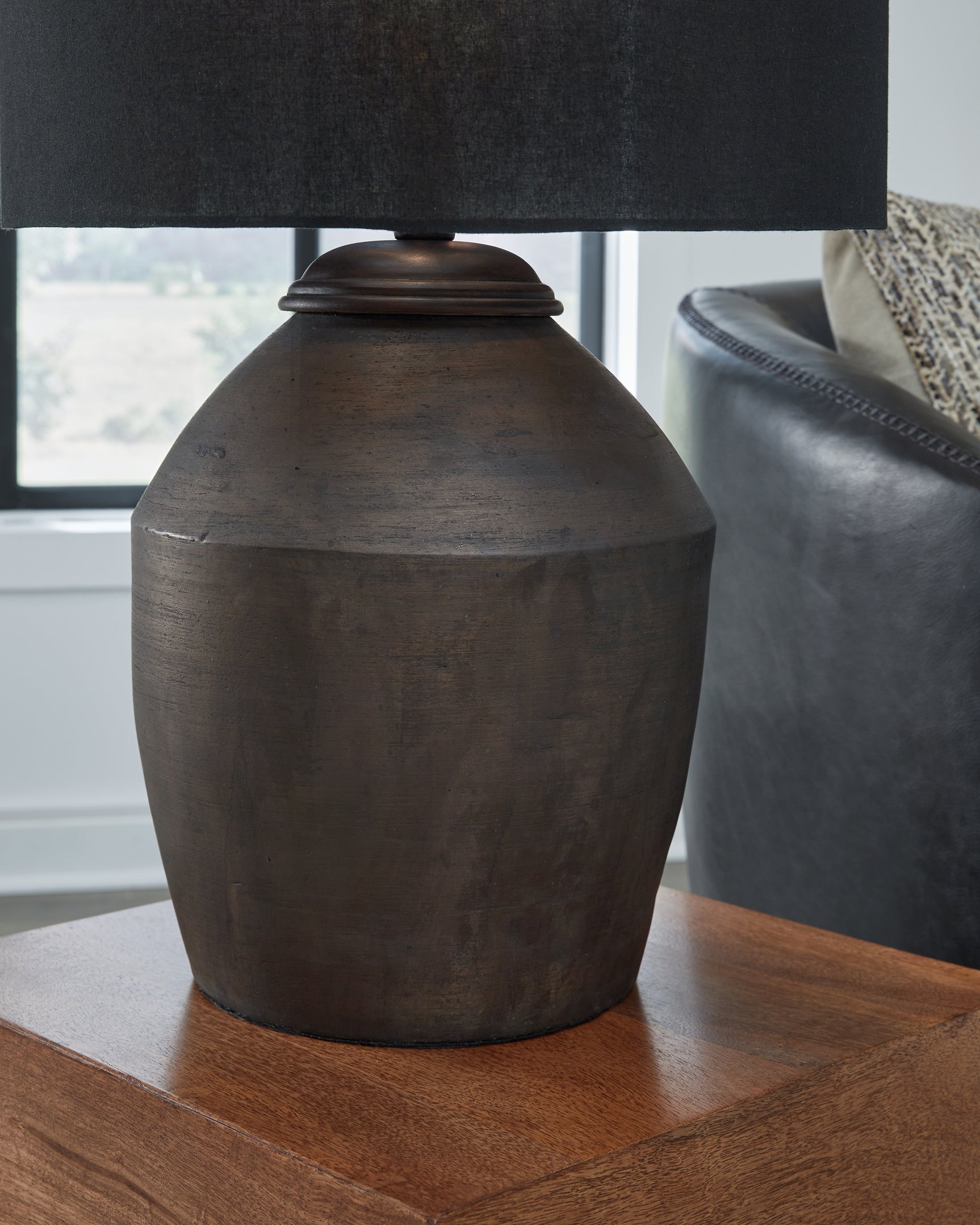 Detail of metallic black terra cotta base