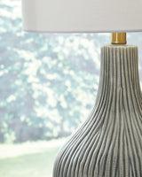 Close-up detail of Judlen lamp base with gray crackle finish and goldtone feet