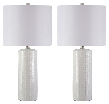 Pair of Steuben white ceramic table lamps on side table