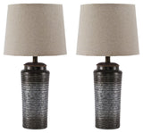 Norbert Gray table lamps shown next to sofa in casual room