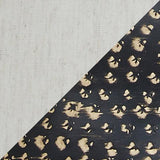 Side view of Maire black and gold table lamp with shade