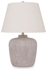 Two lamps on wooden table next to couch