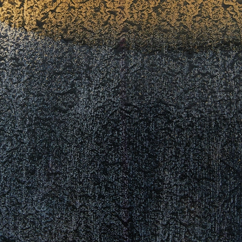 Detail of Adara table lamp's blue and gold finish on metal base