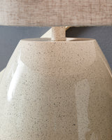 Close-up of Linas table lamp fabric drum shade and base finish