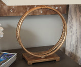 Close-up of antique goldtone metal base detailing