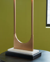 Detail of Malana table lamp's white marble base and brass metal finish