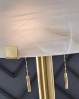 Detail of brass finish on Tobbinsen floor lamp
