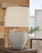 Table lamp close-up showing distressed gray finish detail