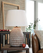 Close-up of distressed metal base of Darrich table lamp