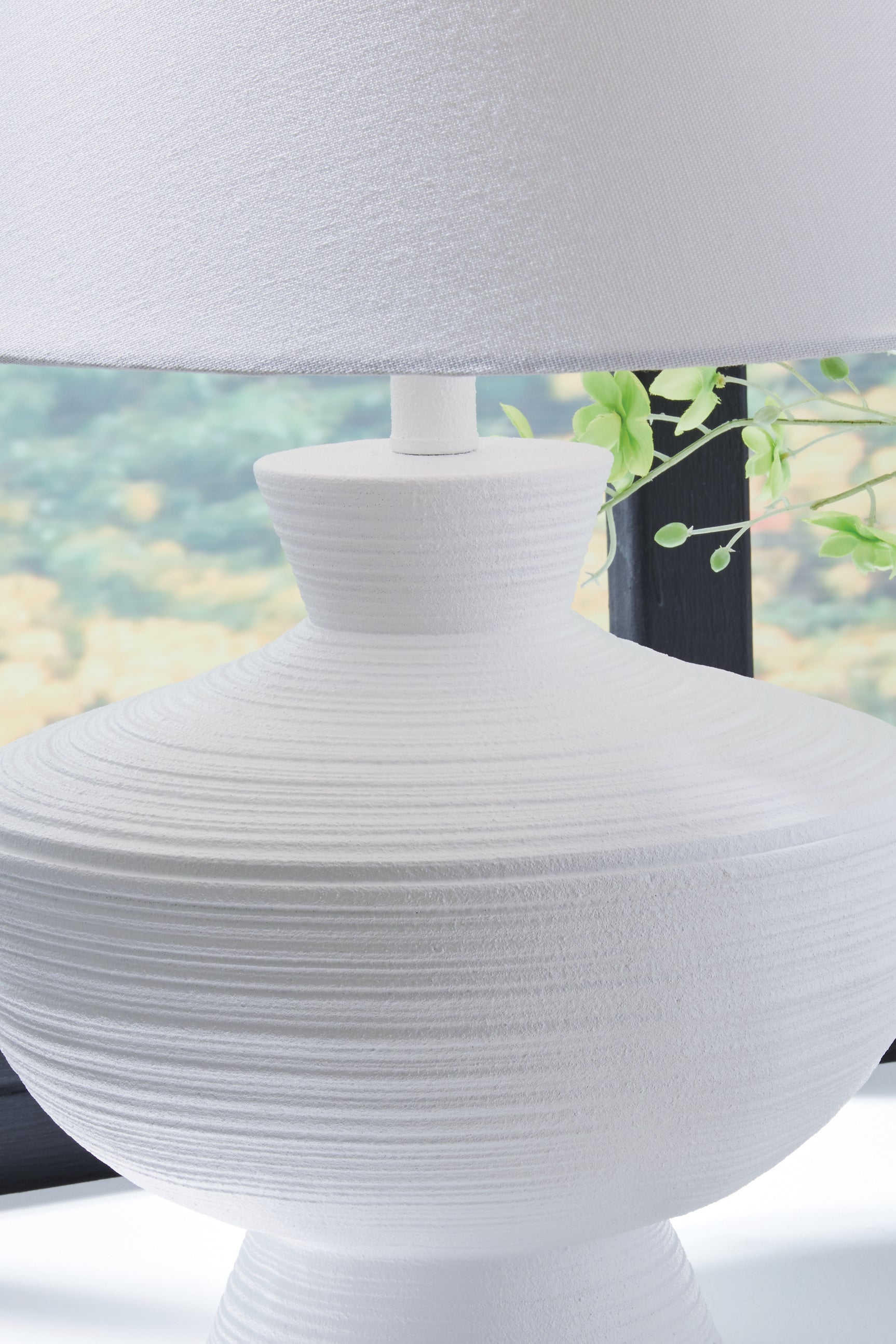 Detail view of horizontal stripe finish on lamp base