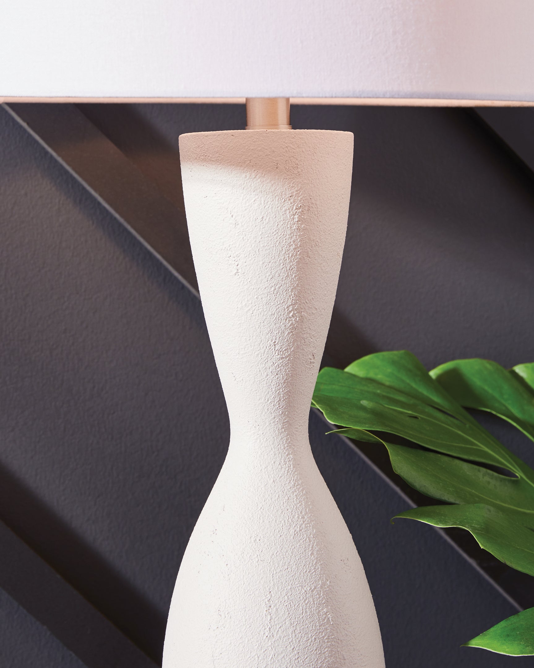 Close-up of the Davinford Table Lamp textured white base and fabric shade