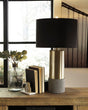 Jacek gray and brass finish table lamp with black drum shade angled view