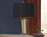 Jacek table lamp illuminating a living room corner