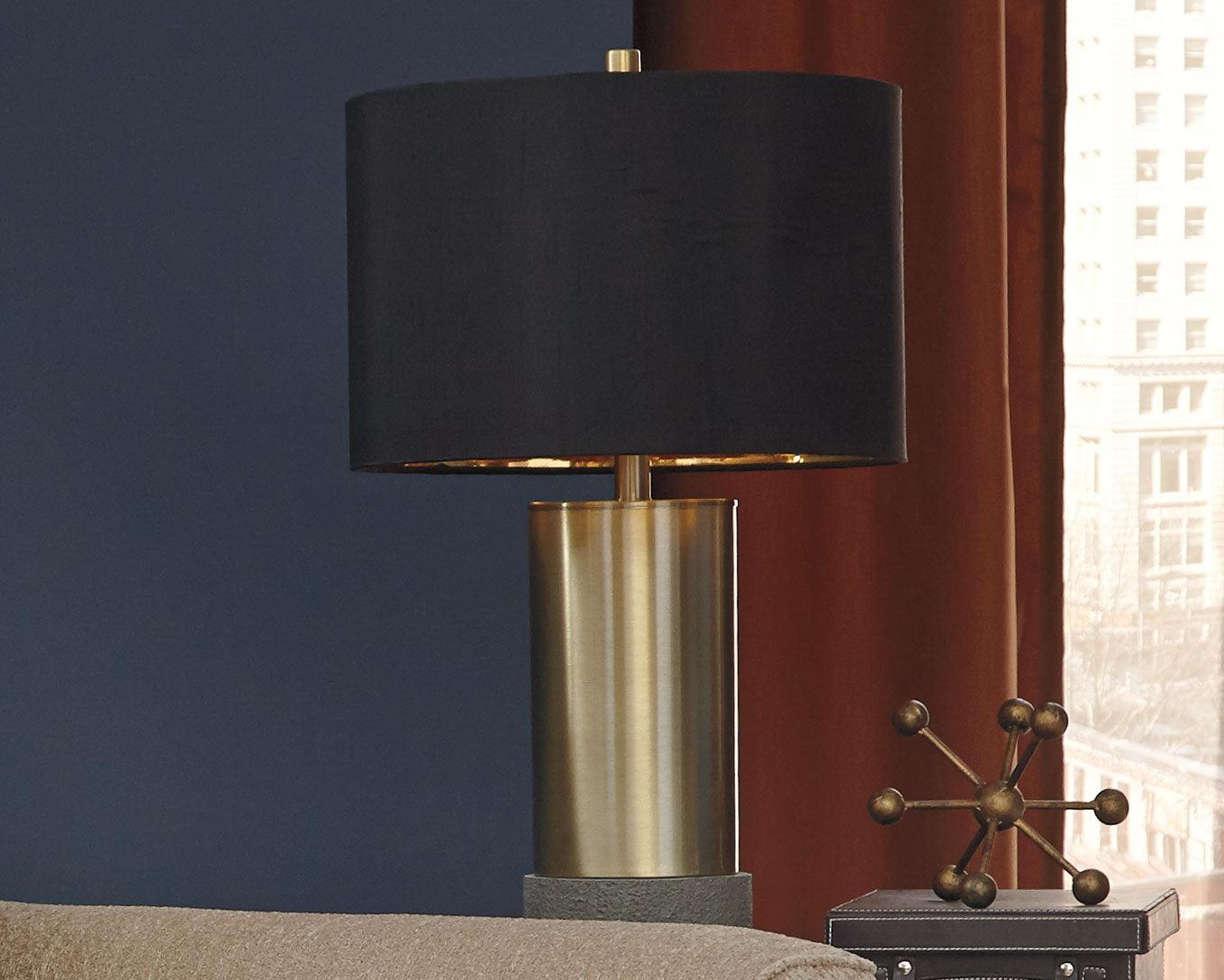 Jacek table lamp illuminating a living room corner