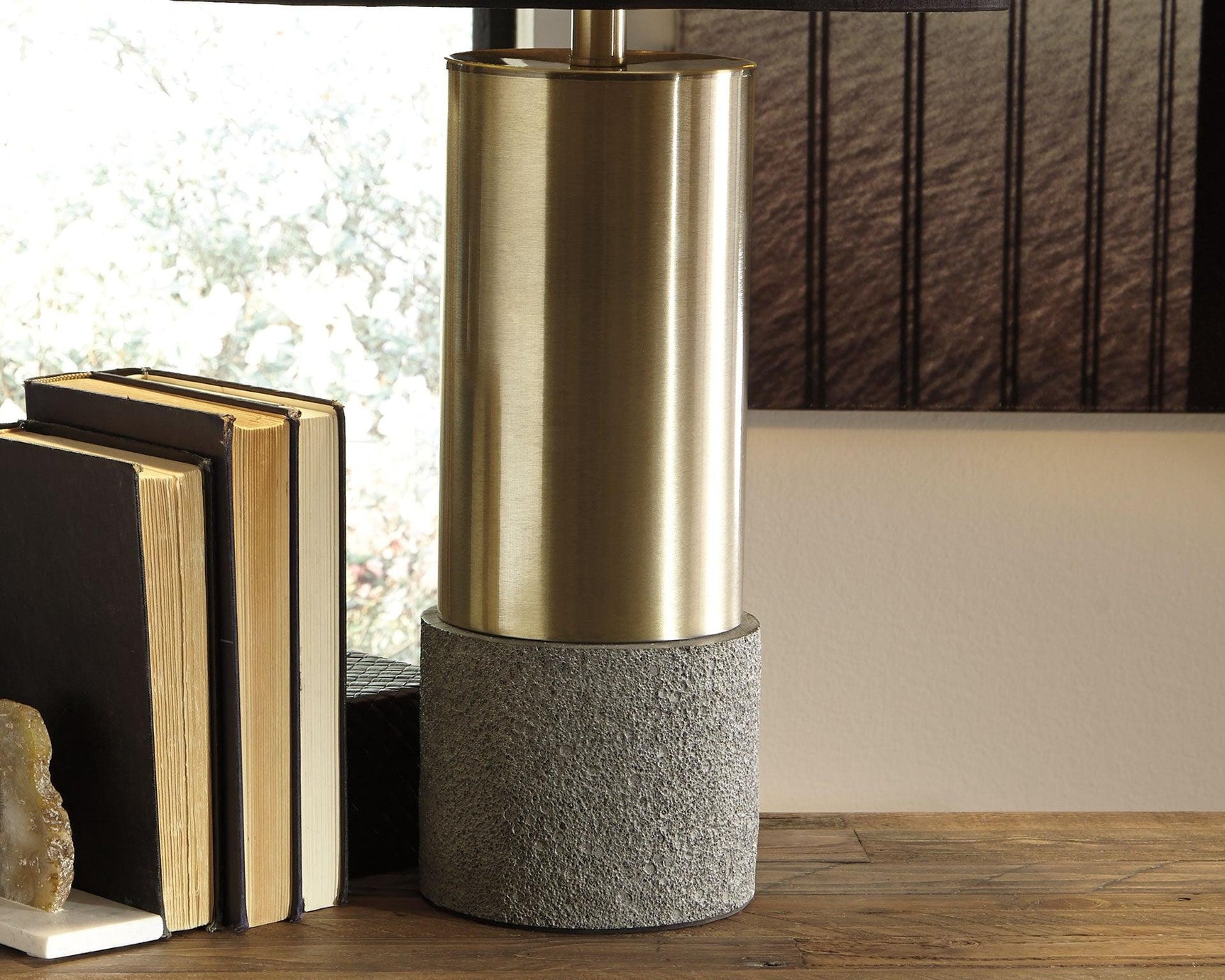 Side angle of Jacek brass finish table lamp highlighting shade and base details