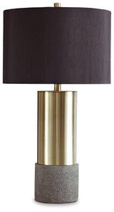 Close-up of Jacek table lamp base showing gray faux concrete texture and brass accents