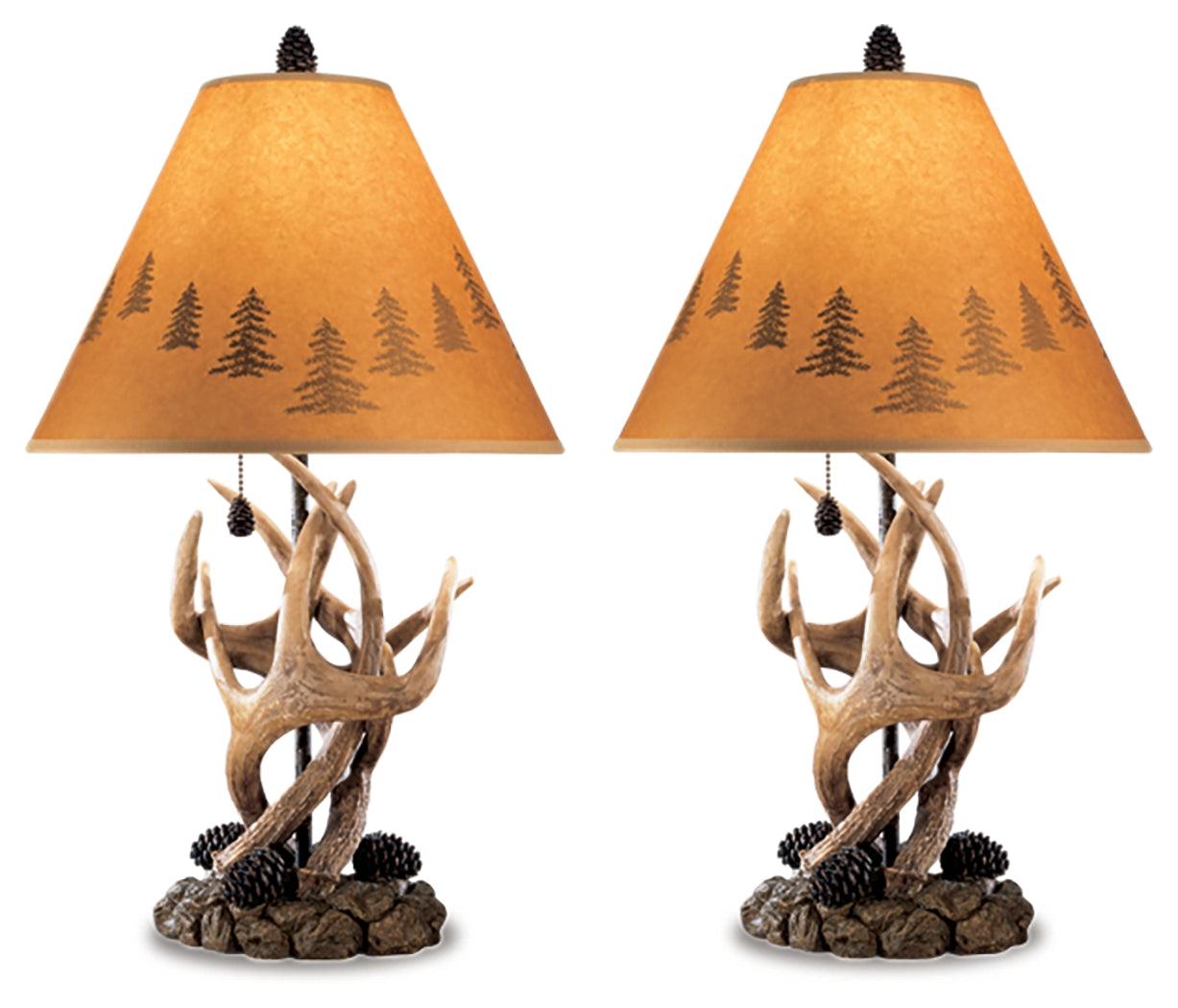 Close-up of Derek Brown lamp base with antler and pinecone detail