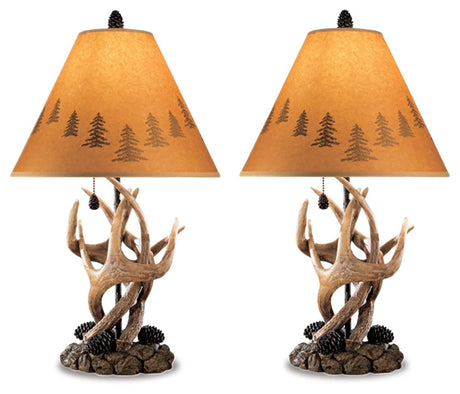 Close-up of Derek Brown lamp base with antler and pinecone detail