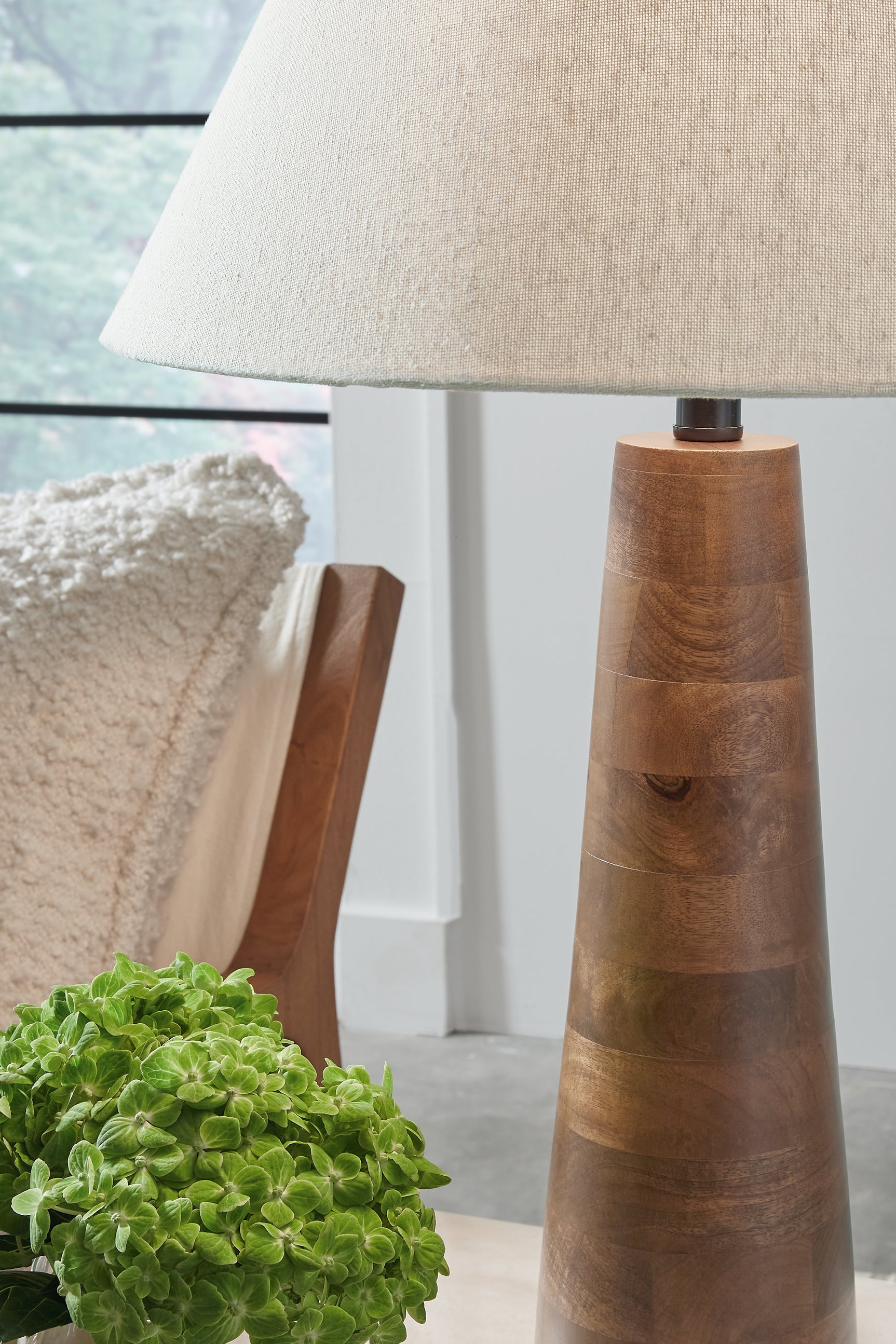 Detail of honey brown wood finish on lamp base