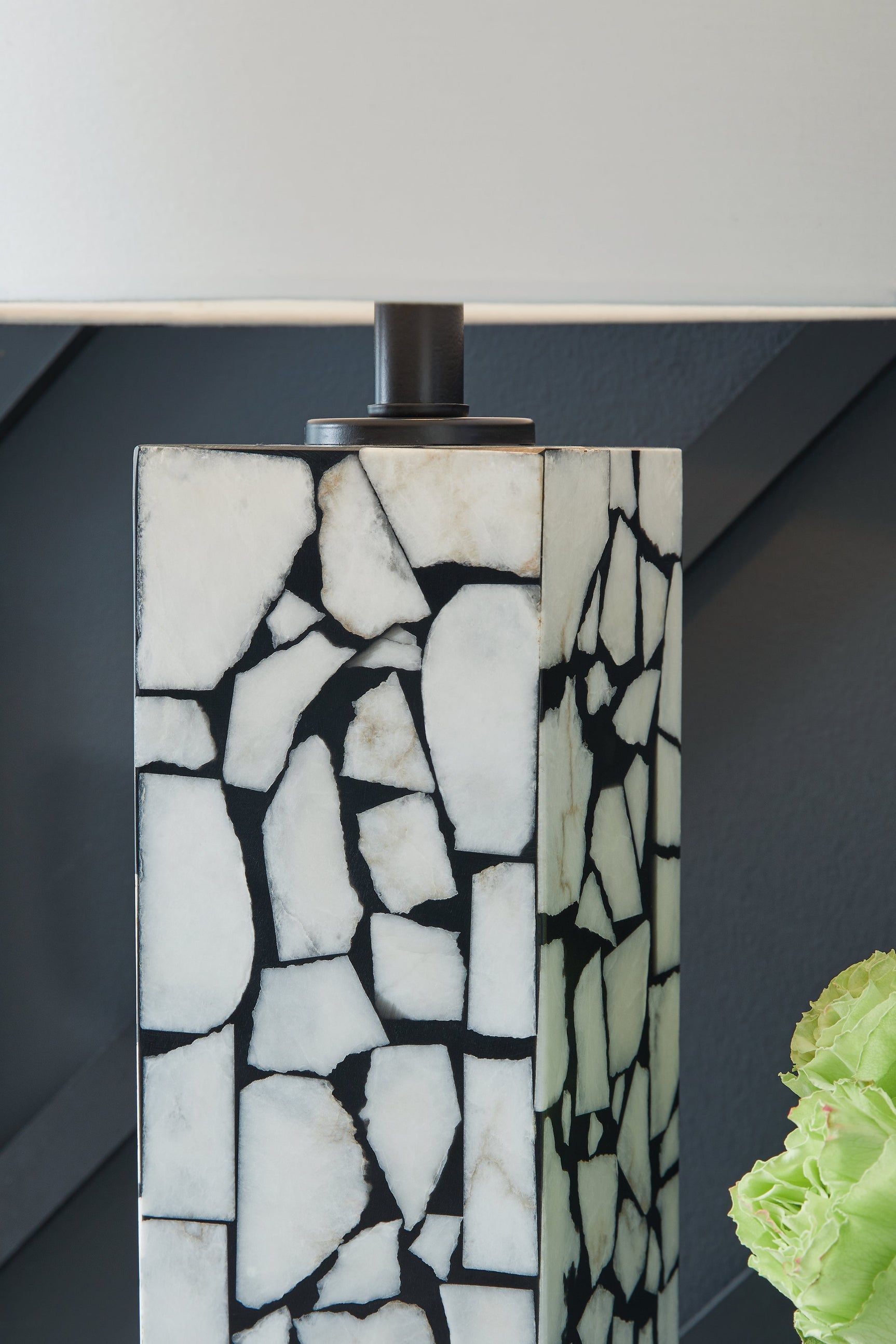 Detail of white marble mosaic pattern on lamp base