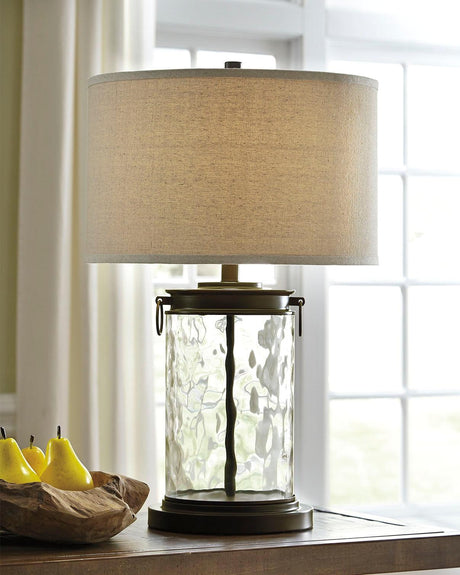 Tailynn table lamp with clear wave glass and bronze finish, angled side view