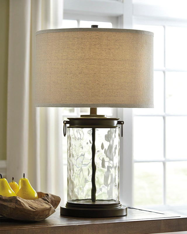 Tailynn table lamp with clear wave glass and bronze finish, angled side view