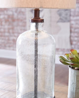Close-up of Bandile table lamp bronze base and seeded glass