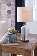 Bandile table lamp illuminated showing clear glass and bronze finish