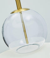 Detail of Samder lamp base showing clear glass and brass accents