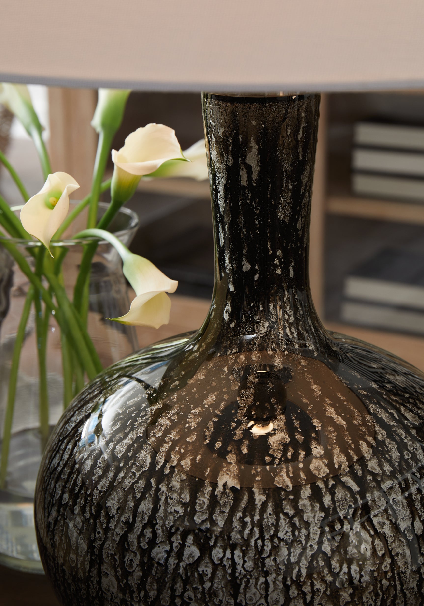 Textured dark glass base of Tenslow lamp