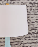 Close-up of fabric shade on Rylanton aqua glass table lamp