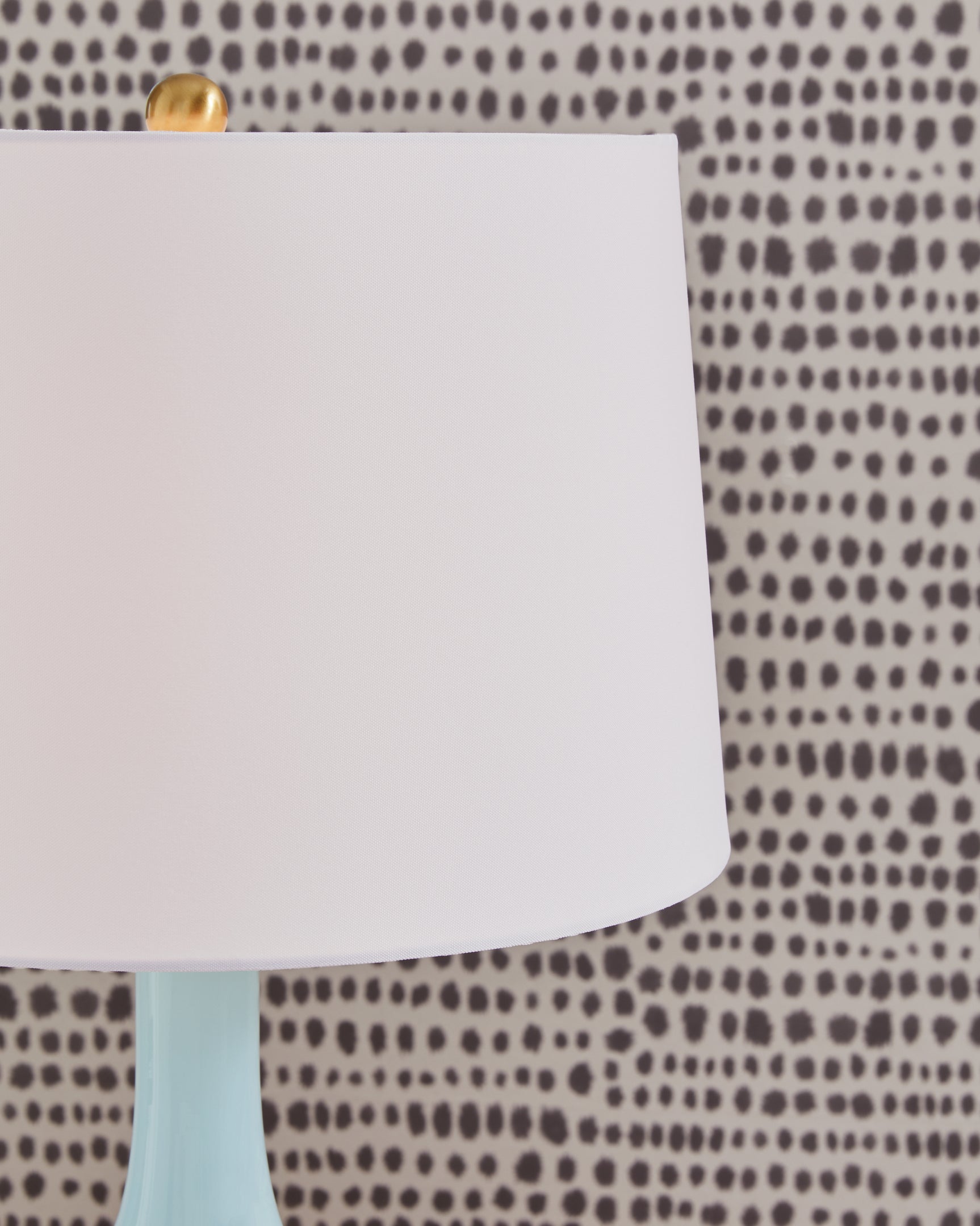 Close-up of fabric shade on Rylanton aqua glass table lamp