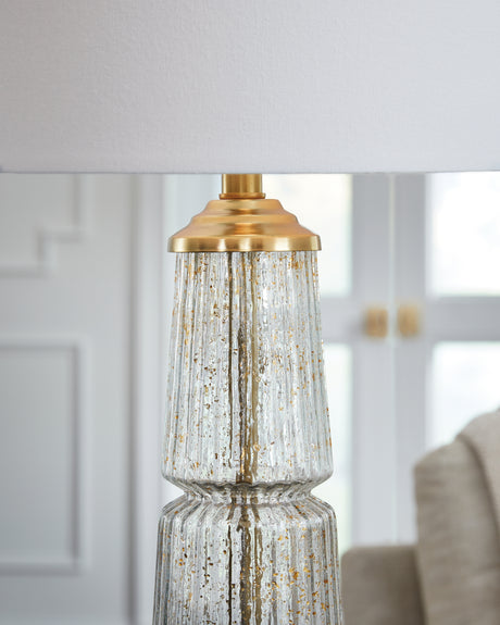 Close-up of clear fluted glass with gold flecks on lamp base