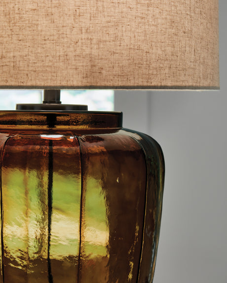 Close-up of the amber glass base and metal details on Bainmore lamp
