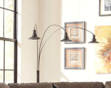 Sheriel Floor Lamp illuminated in a living room setting
