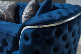 Close-up detail of blue velvet upholstery on sofa