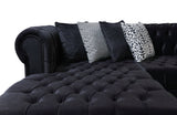 Room setting featuring the Emma Black Velvet sectional sofa