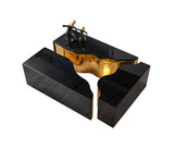 Leah Wood coffee table tops with black finish, gold legs beneath