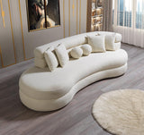 Side perspective of ivory boucle chaise lounge