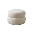 Front angle of Sandy Ivory Boucle Round Ottoman showing ivory boucle texture