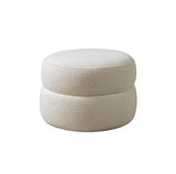 Front angle of Sandy Ivory Boucle Round Ottoman showing ivory boucle texture