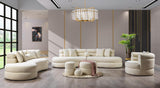 Side view of Sandy Ivory Boucle Round Ottoman highlighting round shape and soft upholstery