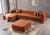 Detail view of burnt orange velvet upholstery on sectional sofa