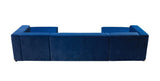 Close-up of blue velvet cushions on sectional sofa